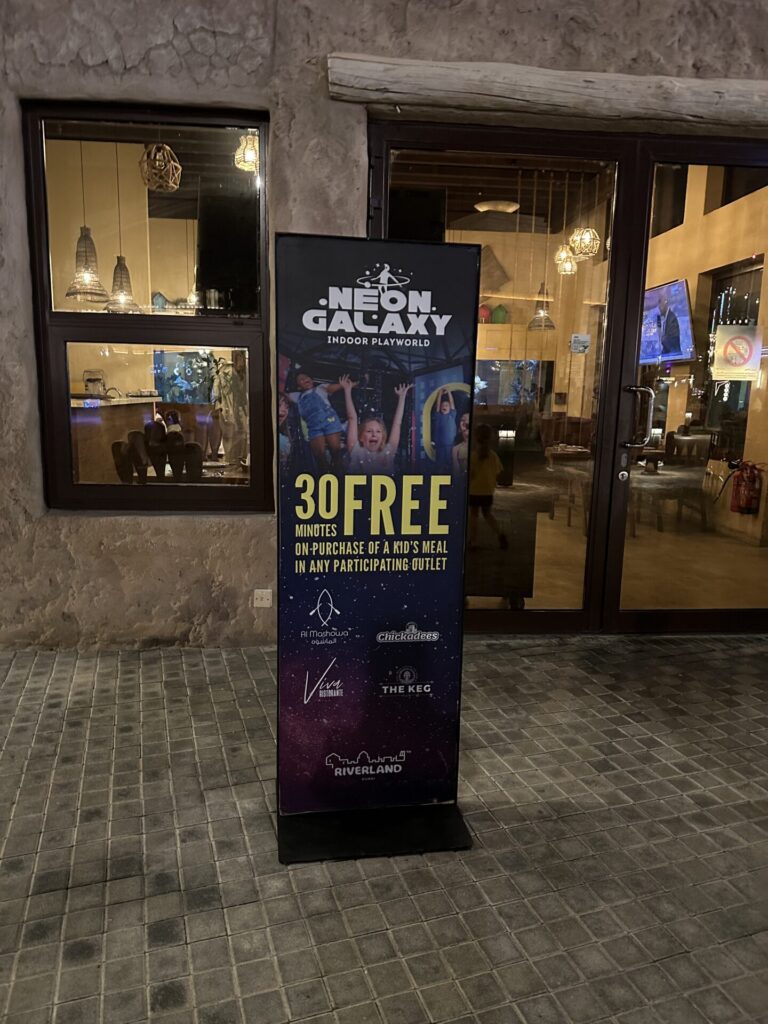 Entrance to Neon Galaxy Dubai with information about the amusement park, as well as discounts.