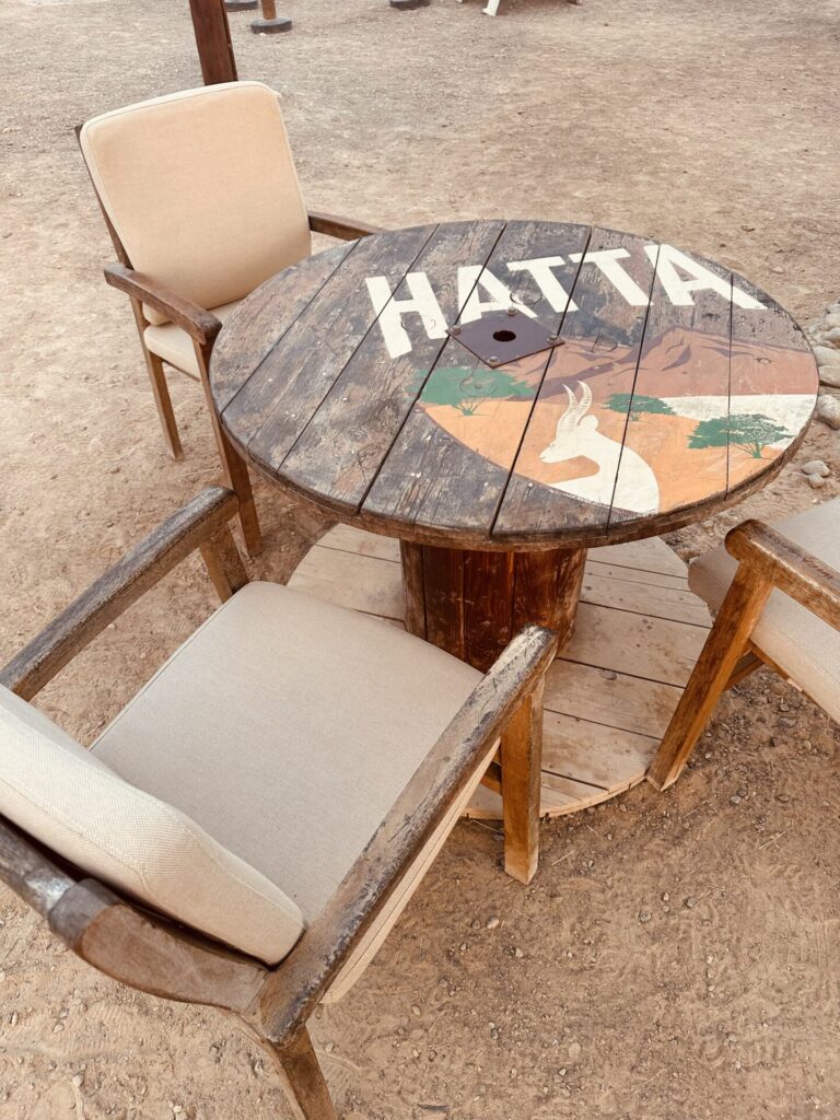 Shown here is a table at the Hatta Wadi Hub. The many food trucks offer the possibility to get food and eat at the table